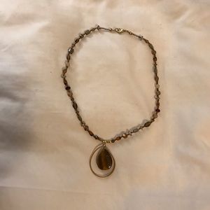 Necklace in brown and gold tones